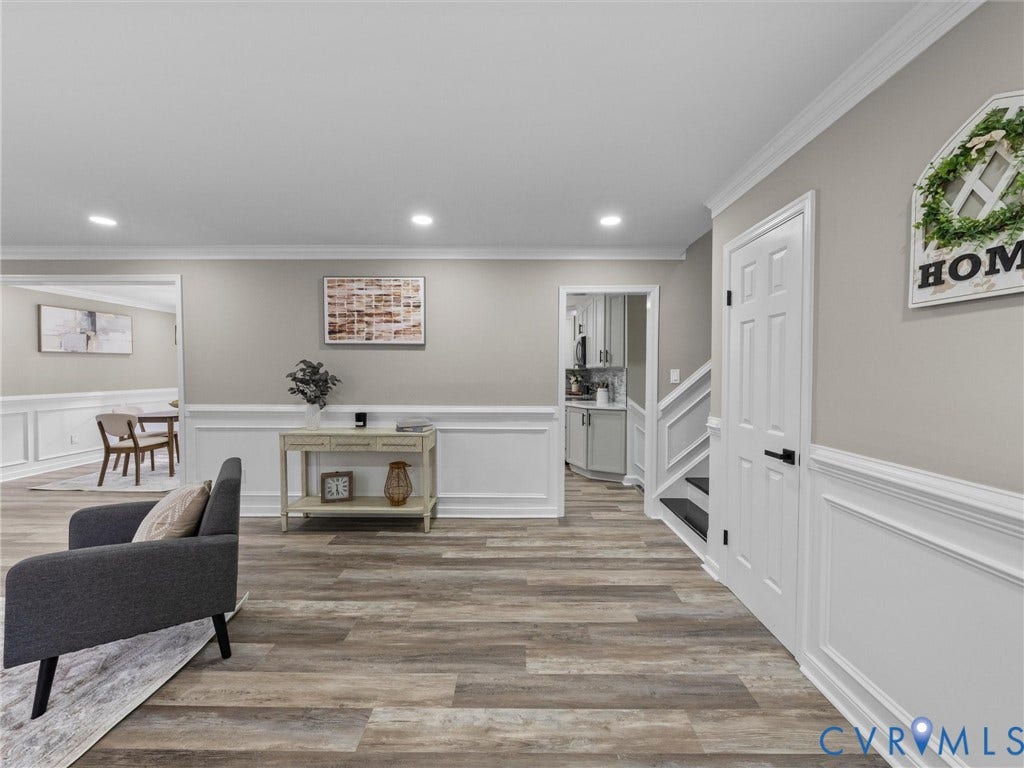 2031 Esquire Road, Midlothian, VA 23235 Wood-finish flooring, recessed lighting, crown molding, chair rail molding, and a paneled door