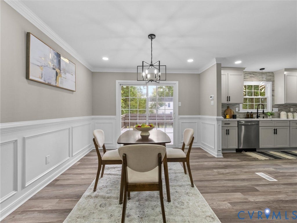 2031 Esquire Road, Midlothian, VA 23235 Wood-finish flooring, wainscoting, recessed lighting, and a modern geometric light fixture