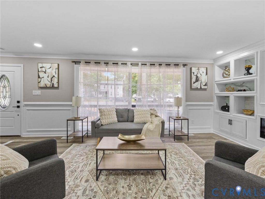 2031 Esquire Road, Midlothian, VA 23235 Recessed lighting, wood-finish flooring, wainscoting, built-in shelving, and an ornate front door