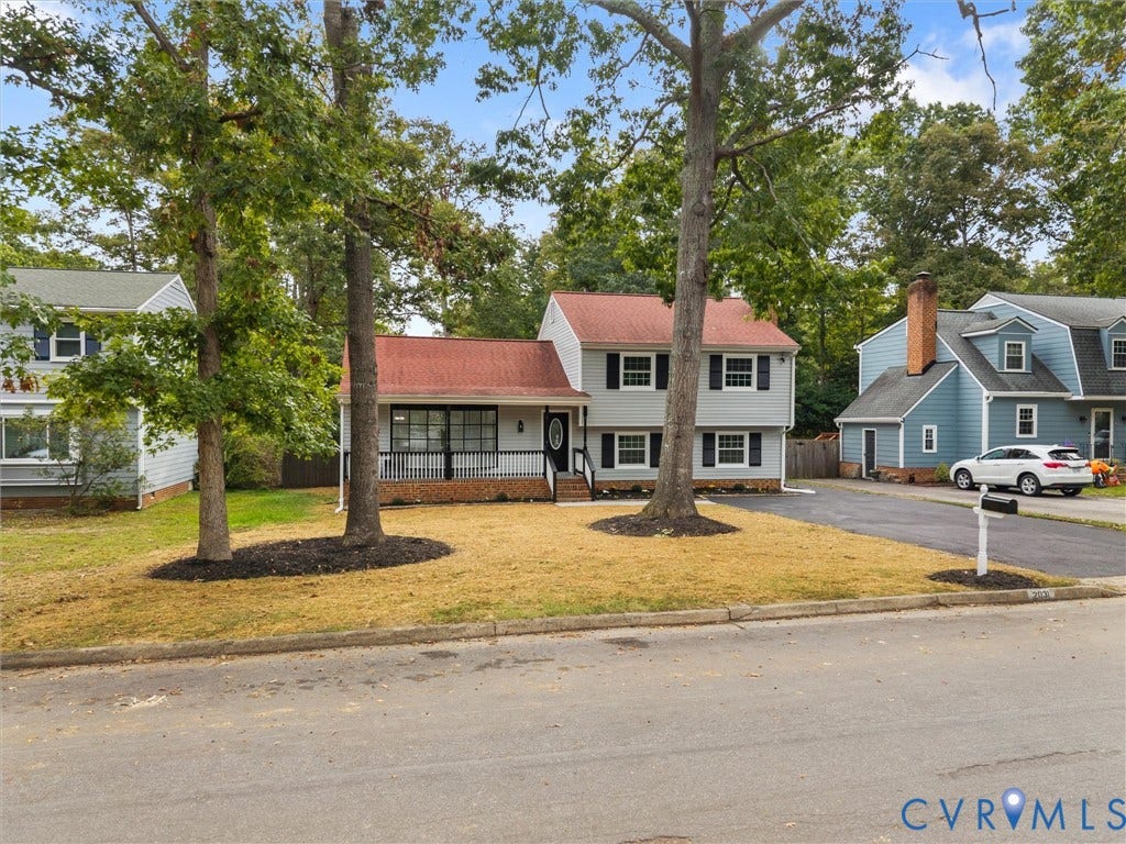 2031 Esquire Road, Midlothian, VA 23235 Two-story residence with a red shingle roof, light gray siding, and black window shutters