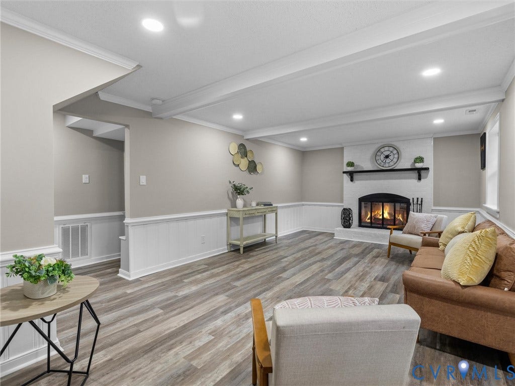 2031 Esquire Road, Midlothian, VA 23235 Recessed lighting, wood-finish flooring, wainscoting, and a fireplace with a mantel
