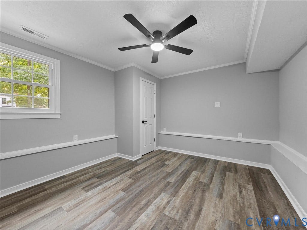 2031 Esquire Road, Midlothian, VA 23235 Wood-finish flooring, white trim, and a ceiling fan with integrated lighting