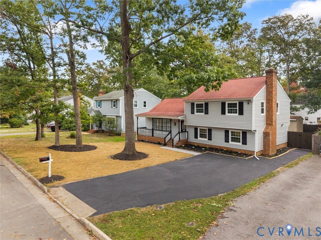 2031 Esquire Road, Midlothian, VA 23235 Two-story siding exterior with contrasting shutters, red roof, and brick chimney