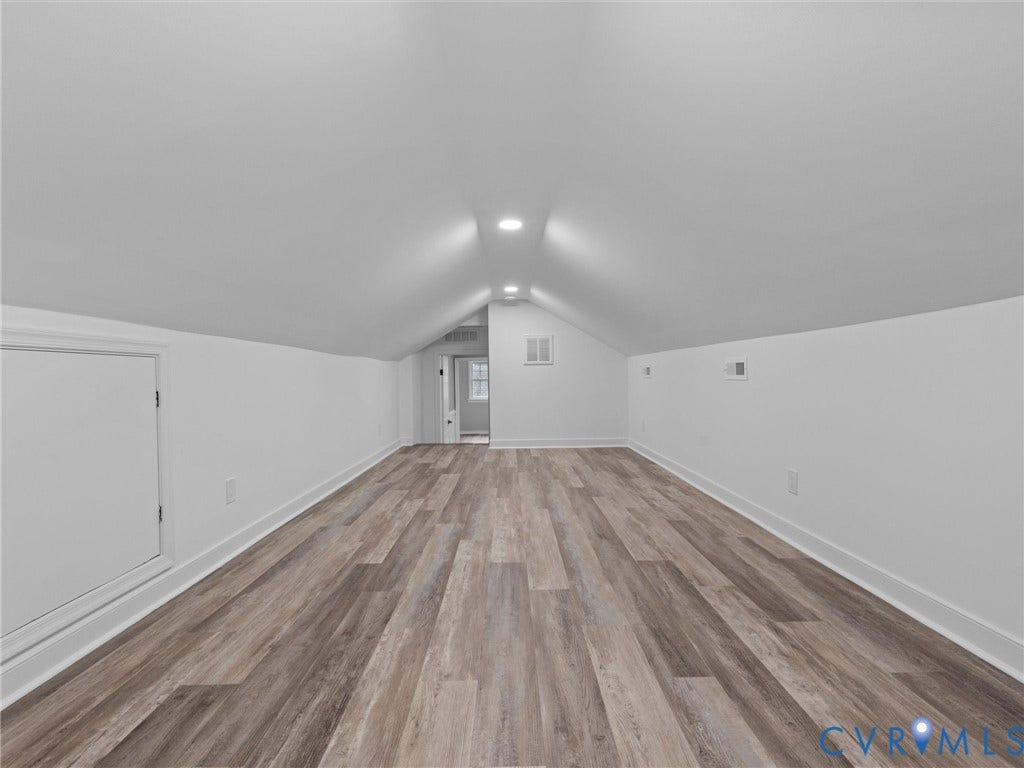 2031 Esquire Road, Midlothian, VA 23235 Vaulted ceiling with recessed lighting, wood-finish flooring, crisp white walls, and a built-in storage access door