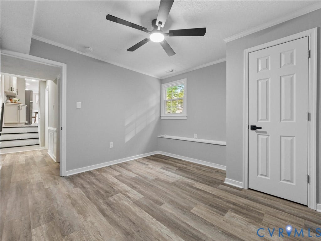 2031 Esquire Road, Midlothian, VA 23235 Room featuring wood-finish flooring, a ceiling fan with integrated lighting, and a single window