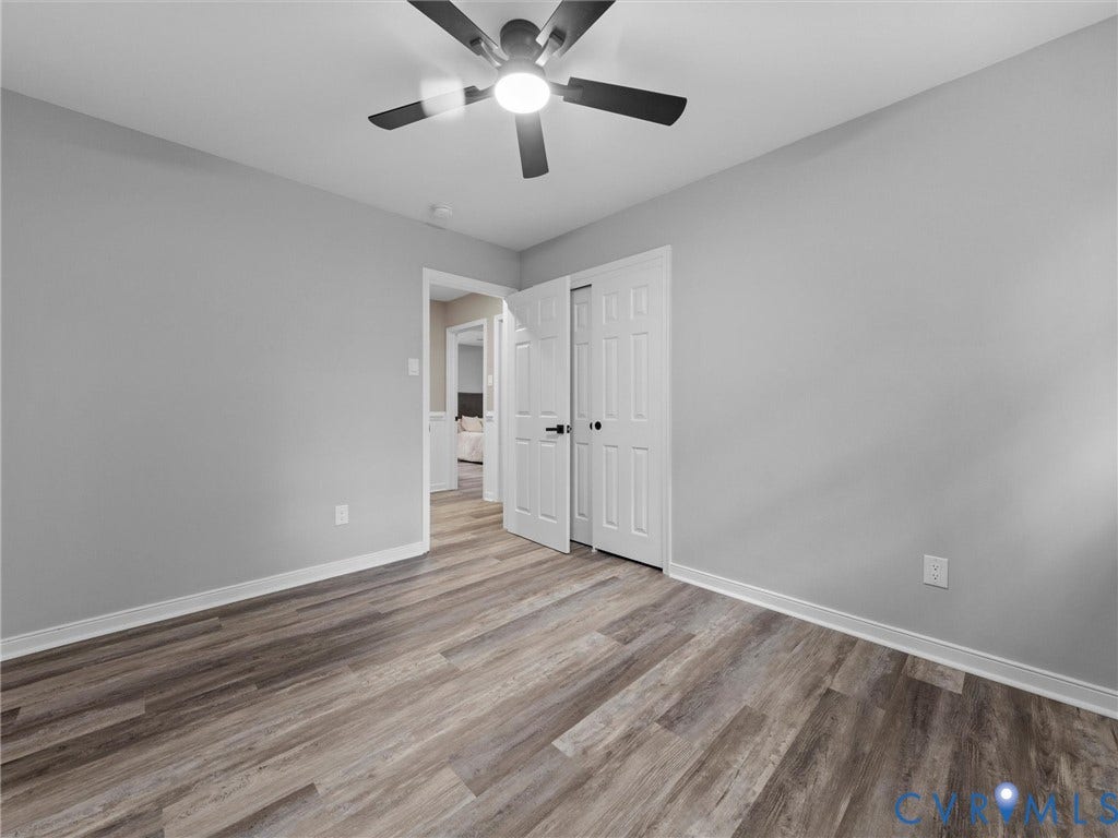 2031 Esquire Road, Midlothian, VA 23235 Wood-finish flooring, ceiling fan with integrated lighting, neutral wall tones, and white trim
