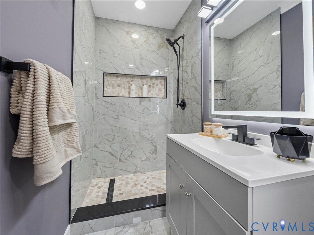 2031 Esquire Road, Midlothian, VA 23235 Walk-in shower with full-height tile surround and an integrated niche