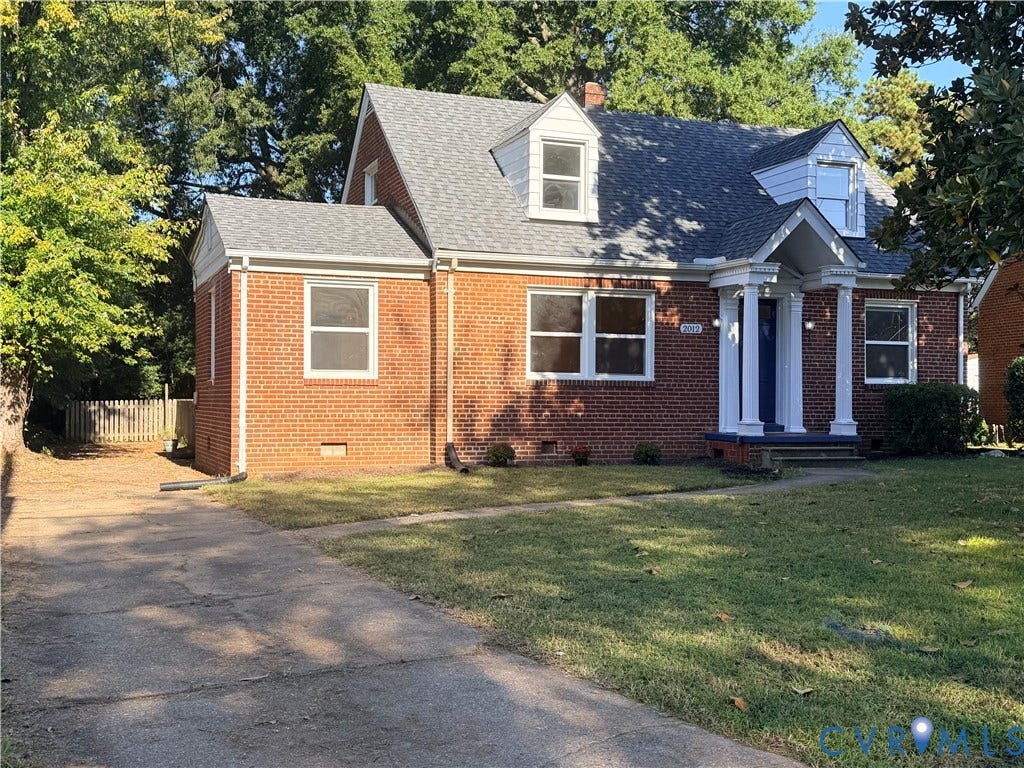 Front of home has extra long driveway