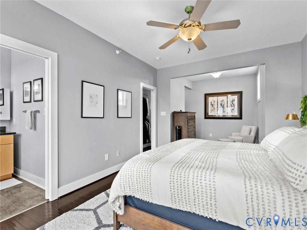 Recessed lighting, dark wood-finish flooring, and a ceiling fan with integrated lighting