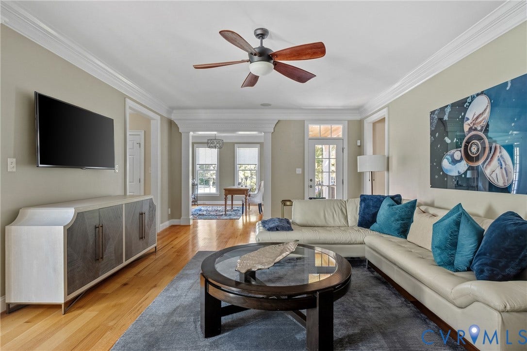 Recessed lighting, crown molding, wood-finish flooring, ceiling fan, and a light-filled interior