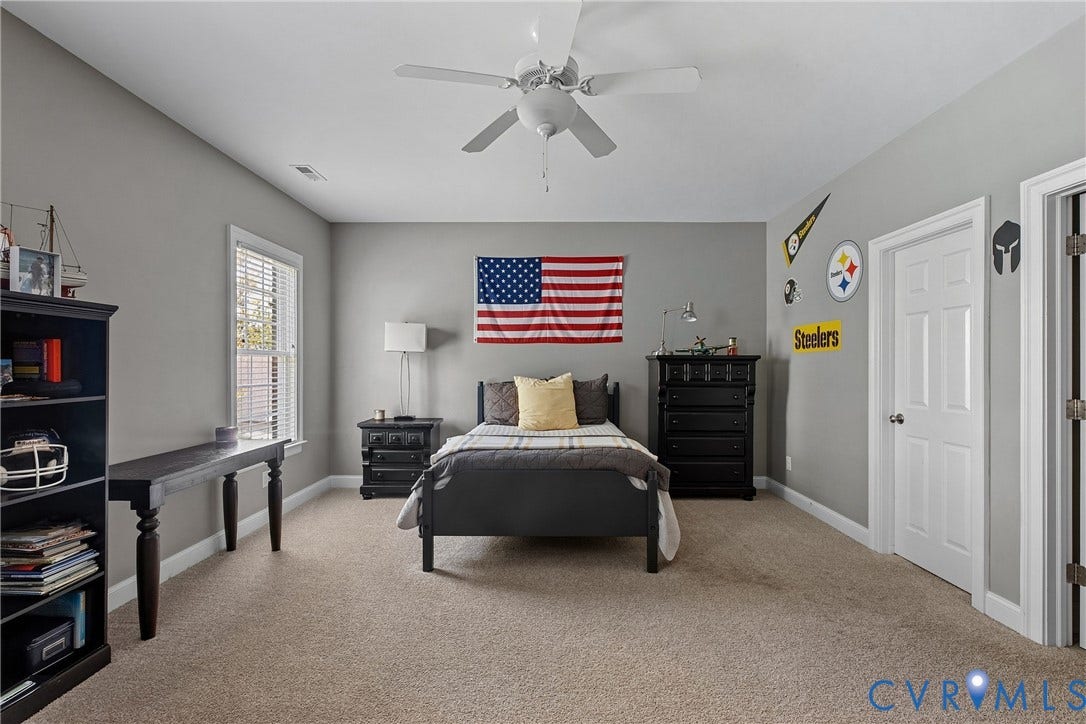 Neutral-toned carpeting paired with light gray walls