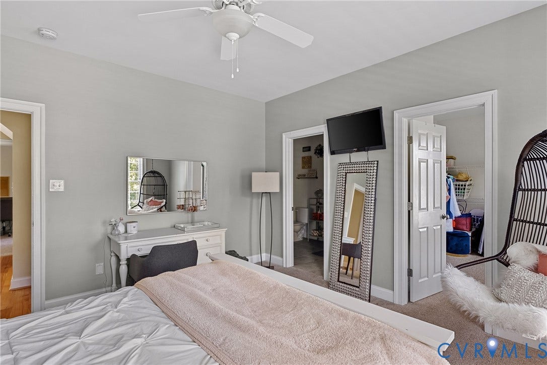 Recessed ceiling fan, light gray wall paint, and two open doorways