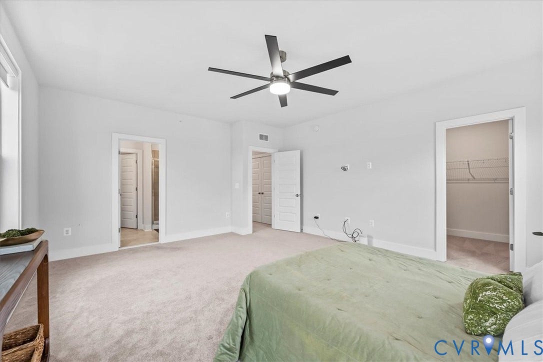 Spacious room with light-toned carpeting and neutral wall tones