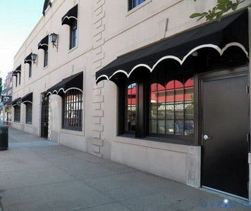 Faade with multiple windows and a solid entry door