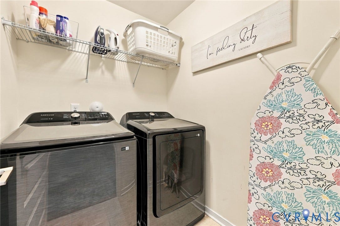 Laundry area with wire shelving and wall-mounted ironing board