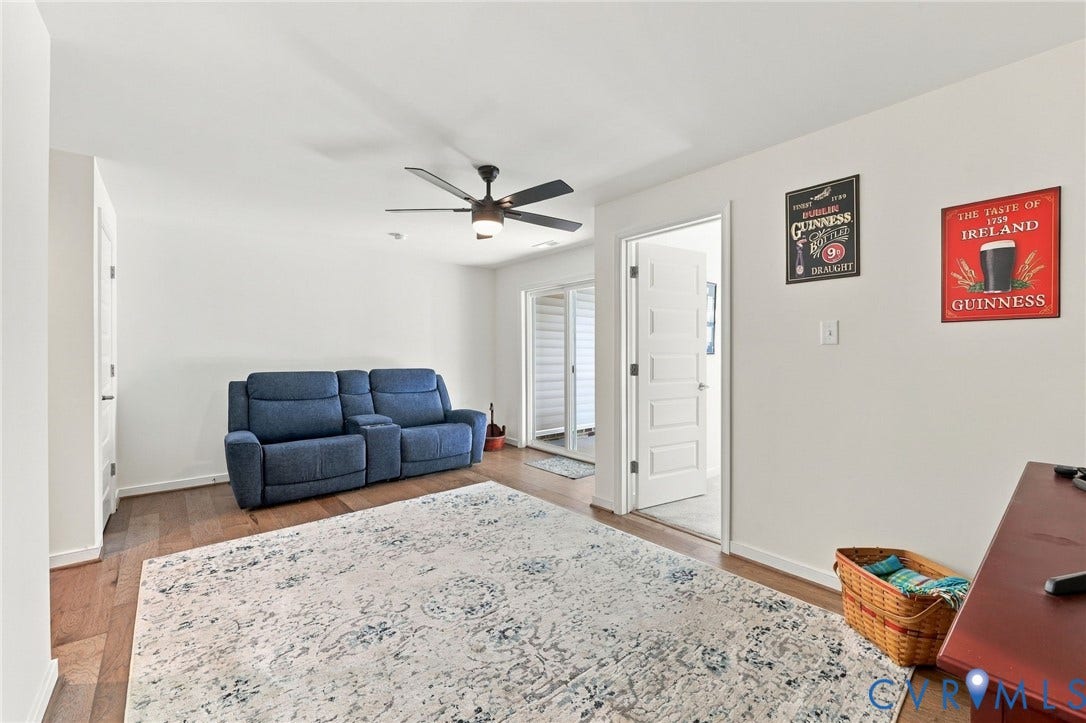 Wood-finish flooring with a modern ceiling fan