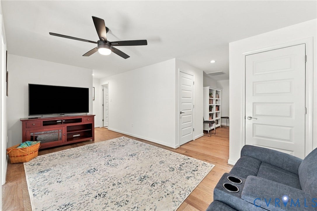 Wood-finish flooring, recessed lighting, and a modern ceiling fan