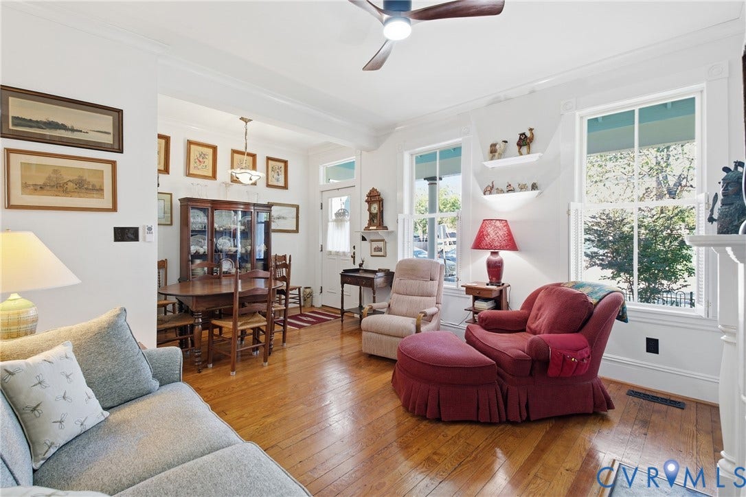 Hardwood flooring throughout, recessed lighting, and a ceiling fan with light fixture