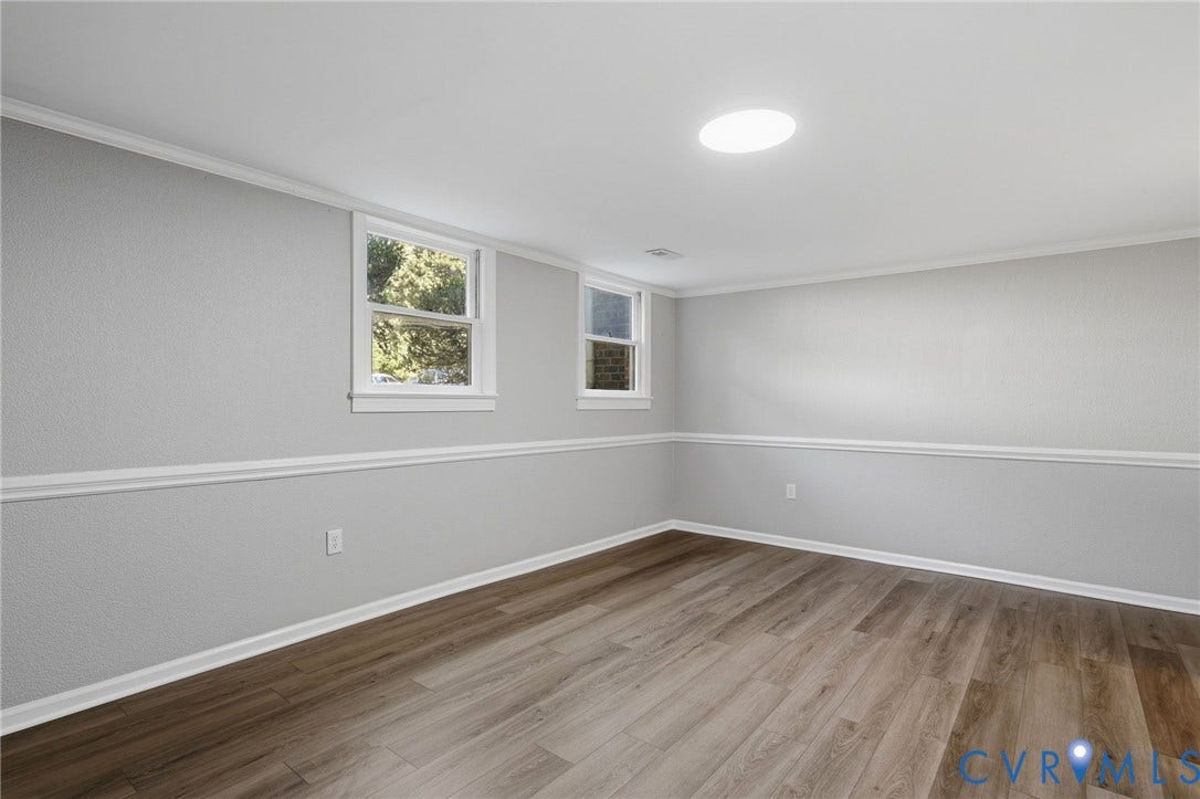 55 Dehaven Drive, Henrico, VA 23238 Wood-finish flooring, white crown molding, chair rail molding, recessed lighting, and dual windows