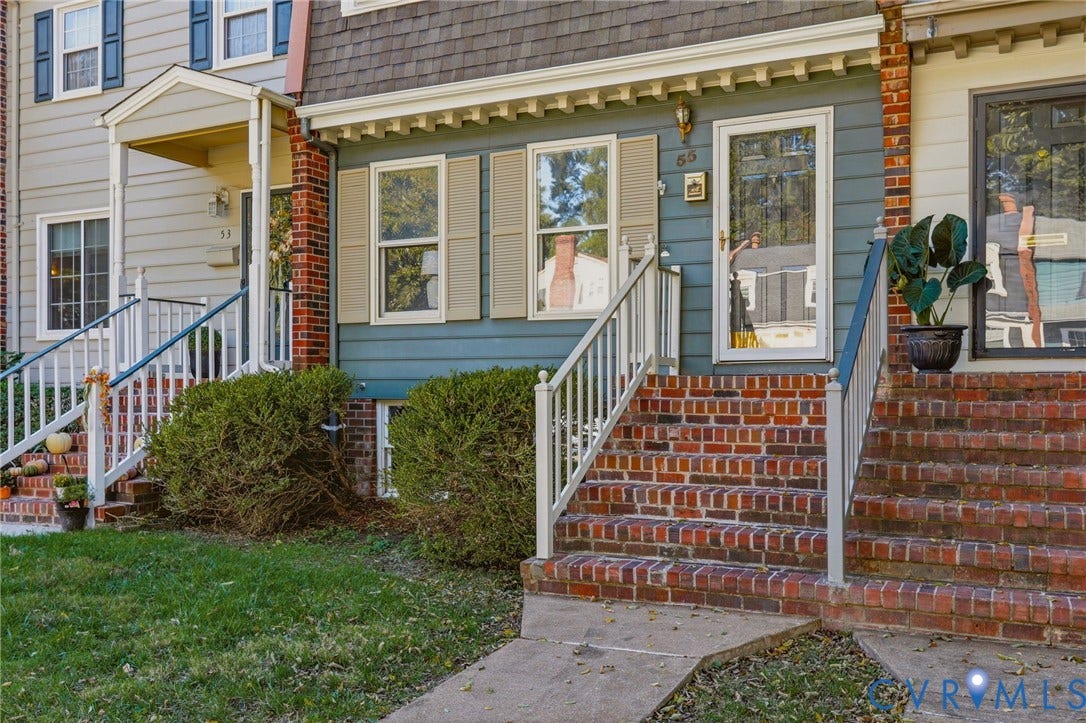 55 Dehaven Drive, Henrico, VA 23238 Brick facade with white railings and mature shrubbery