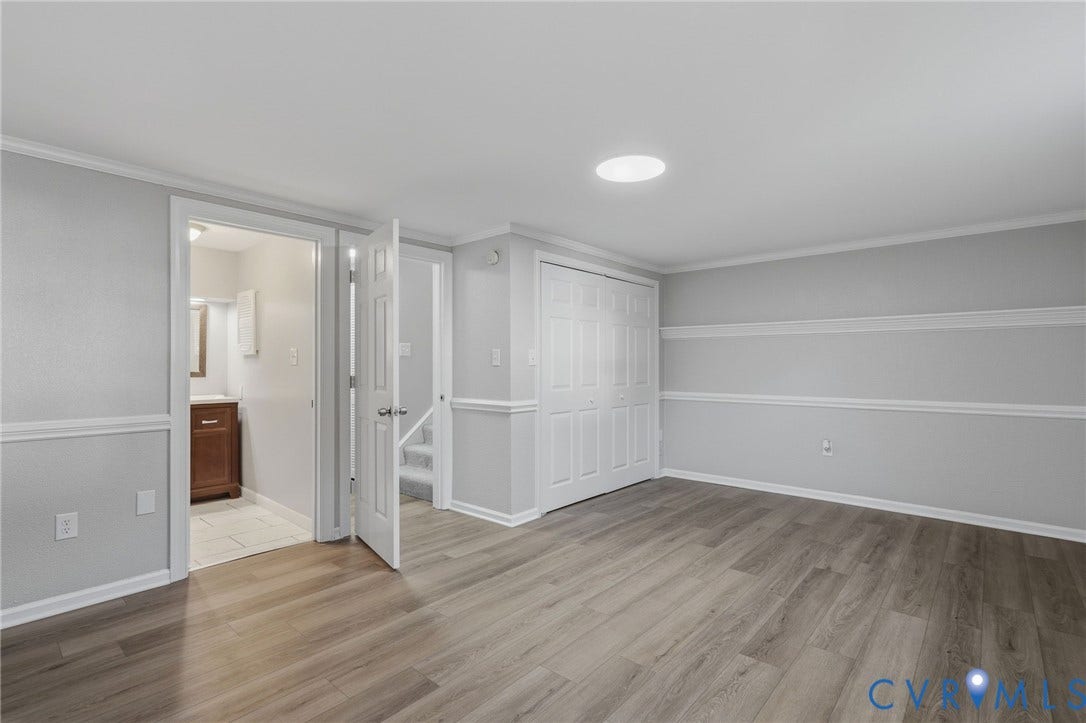 55 Dehaven Drive, Henrico, VA 23238 Wood-finish flooring, white trim details, recessed ceiling lighting, and bi-fold closet doors