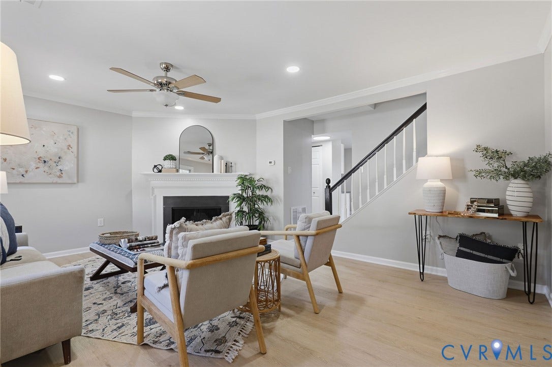 55 Dehaven Drive, Henrico, VA 23238 Recessed lighting, light wood-finish flooring, white fireplace, ceiling fan, and a staircase with a dark wood handrail