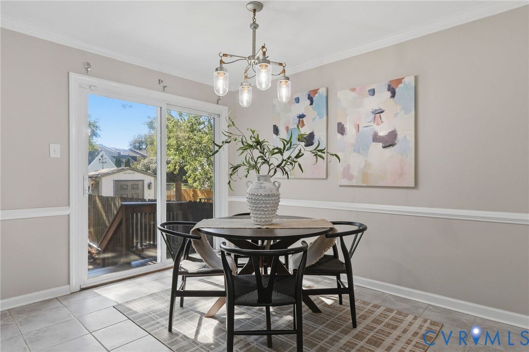 55 Dehaven Drive, Henrico, VA 23238 Sliding glass door, crown molding, chair rail molding, tiled flooring, pendant lighting fixture