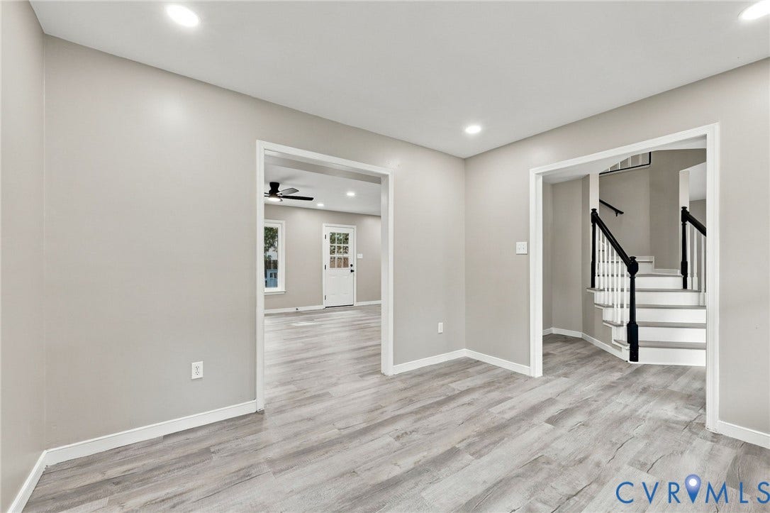5831 Larrymore Road, Richmond, VA 23225 Neutral interior featuring wood-finish flooring, recessed lighting, and a staircase with white risers and a black handrail