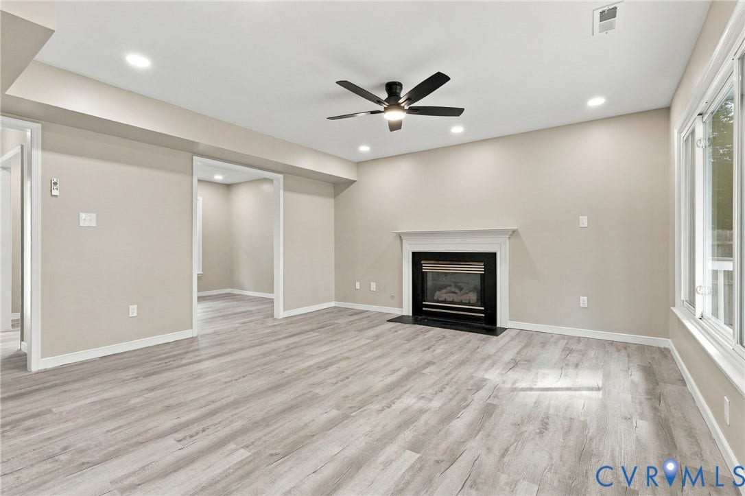 5831 Larrymore Road, Richmond, VA 23225 Living area featuring wood-finish flooring, a fireplace with a mantel and black surround, recessed lighting, and a ceiling fan