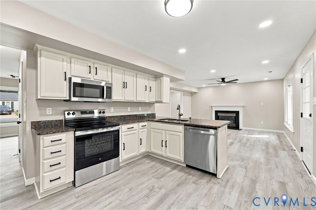 5831 Larrymore Road, Richmond, VA 23225 Kitchen featuring off-white cabinetry, stone-finish countertops, stainless steel appliances, recessed lighting, and wood-finish flooring