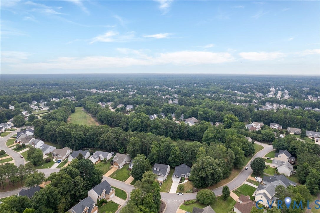 13742 Spyglass Hill Circle, Chesterfield, VA 23832 Aerial perspective featuring a residential cul-de-sac setting surrounded by mature tree lines and expansive natural foliage