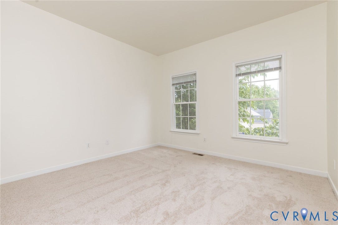 13742 Spyglass Hill Circle, Chesterfield, VA 23832 Neutral-toned interior room featuring wall-to-wall carpeting and two dual-pane double-hung windows with grid muntins