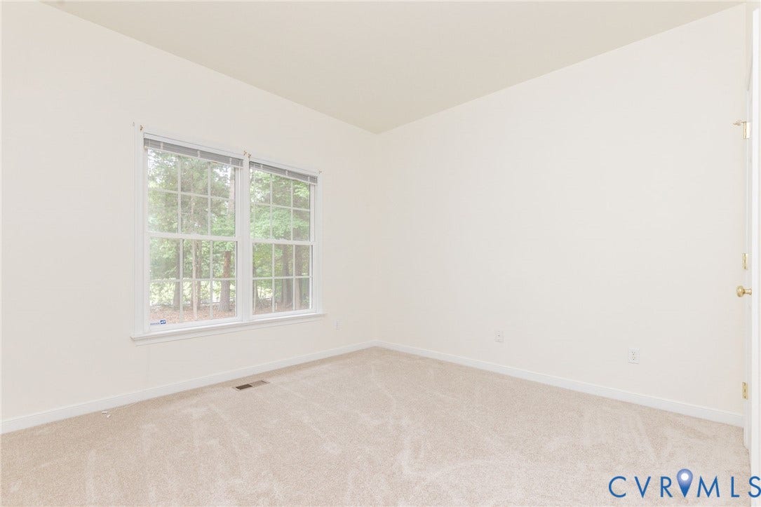 13742 Spyglass Hill Circle, Chesterfield, VA 23832 Neutral interior space featuring wall-to-wall carpeting and double-pane windows with muntins