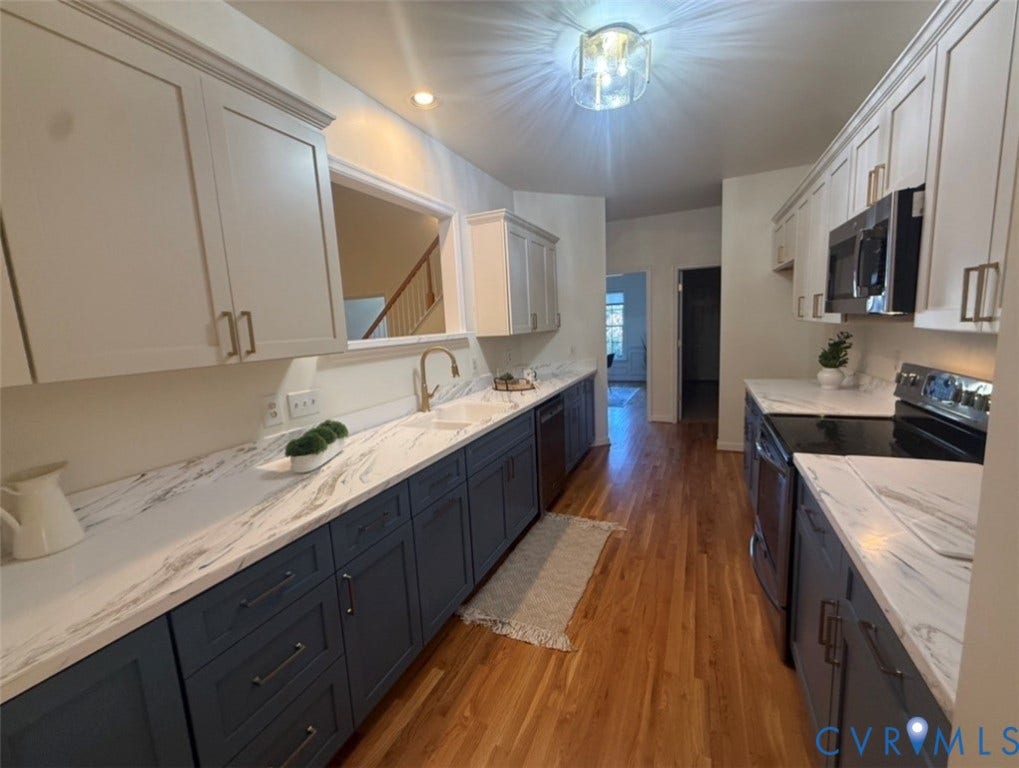 13742 Spyglass Hill Circle, Chesterfield, VA 23832 Kitchen featuring dual-tone cabinetry, stone-finish countertops, wood-finish flooring, brass-tone hardware, and built-in stainless steel appliances