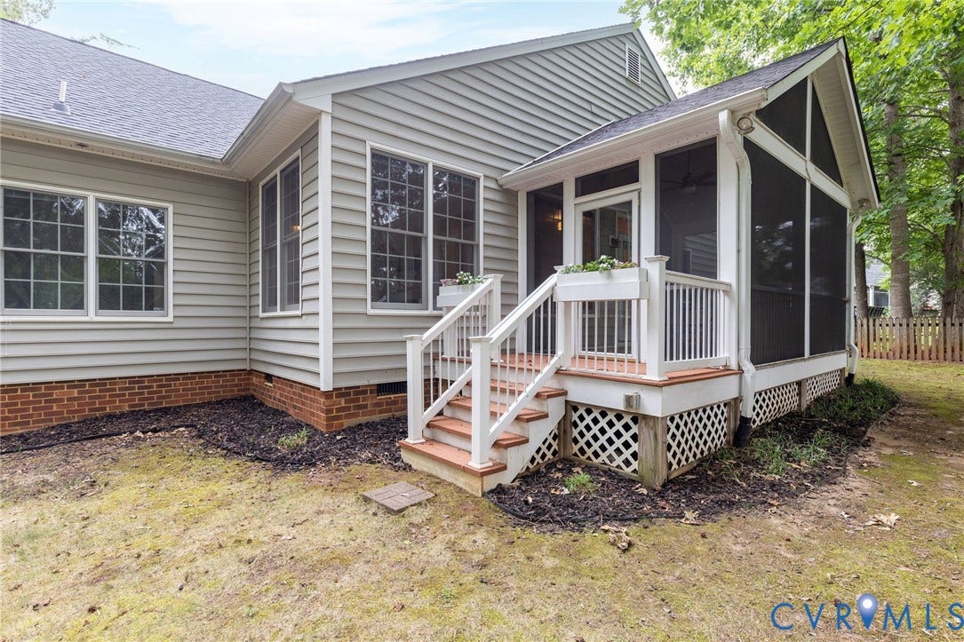 13742 Spyglass Hill Circle, Chesterfield, VA 23832 Exterior featuring horizontal lap siding, brick foundation masonry, and a screened porch with white railing, lattice skirting, and an integrated staircase