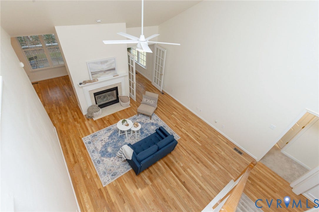 13742 Spyglass Hill Circle, Chesterfield, VA 23832 Vaulted ceilings, wood-finish flooring, fireplace with a tiered mantel, and white French doors