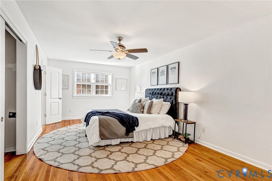 4520 Grove Avenue, #U5, Westhampton, Richmond, VA 23221 Hardwood flooring throughout, white walls, white trim, and a ceiling fan with integrated lighting