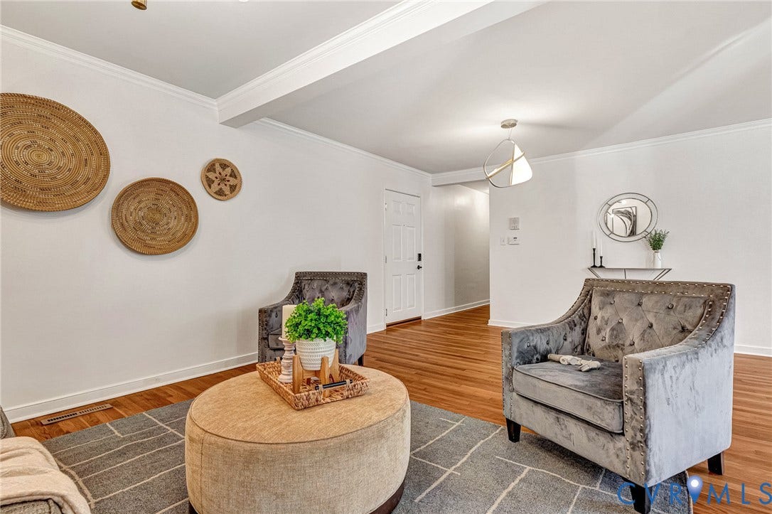4520 Grove Avenue, #U5, Westhampton, Richmond, VA 23221 Hardwood flooring throughout, white walls, and a recessed ceiling beam