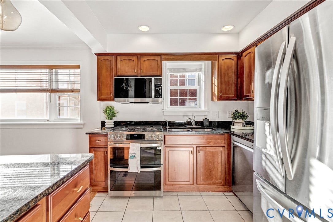 4520 Grove Avenue, #U5, Westhampton, Richmond, VA 23221 Kitchen featuring wood cabinetry, stainless steel appliances, dark countertops, tile flooring, and recessed lighting