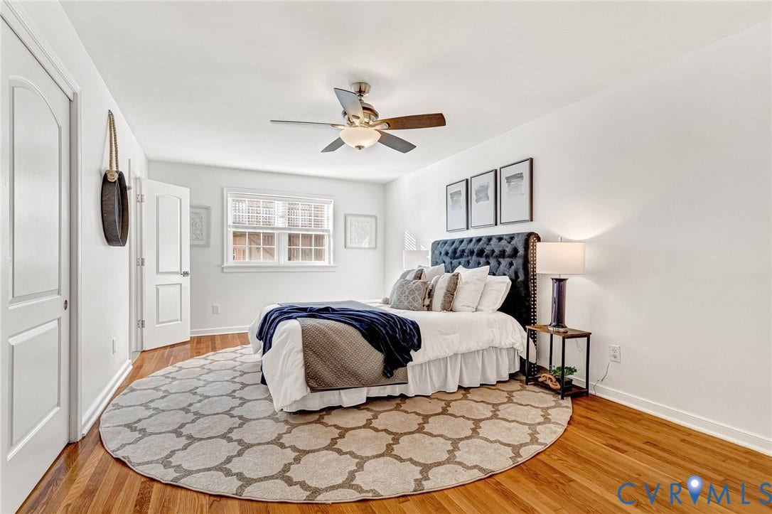 4520 Grove Avenue, #U5, Westhampton, Richmond, VA 23221 Hardwood flooring, white painted walls, window with white trim, ceiling fan with integrated lighting, and white paneled doors