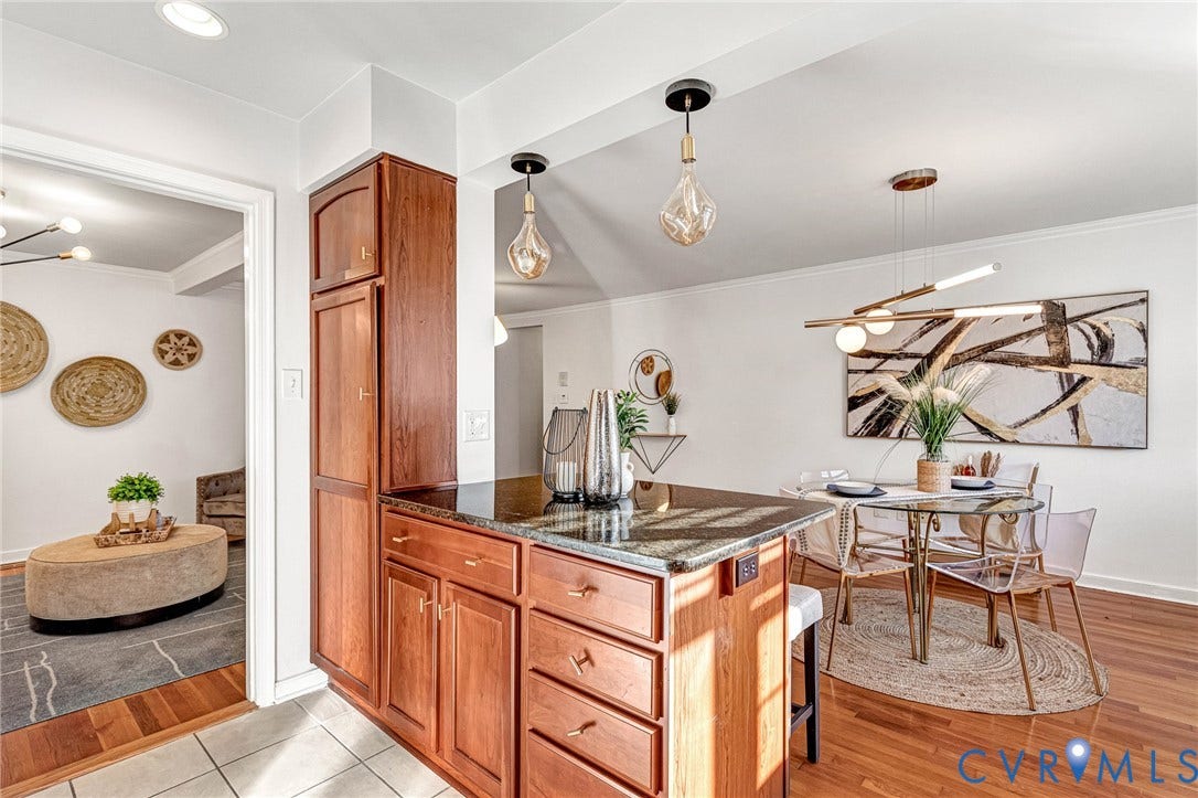 4520 Grove Avenue, #U5, Westhampton, Richmond, VA 23221 Wood-finish flooring, dark wood cabinetry, and granite countertops