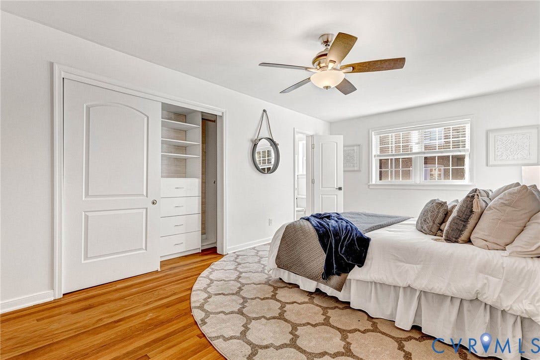 4520 Grove Avenue, #U5, Westhampton, Richmond, VA 23221 Hardwood-style flooring, white paneled doors, built-in closet organization system, ceiling fan with integrated lighting, and a double-hung window