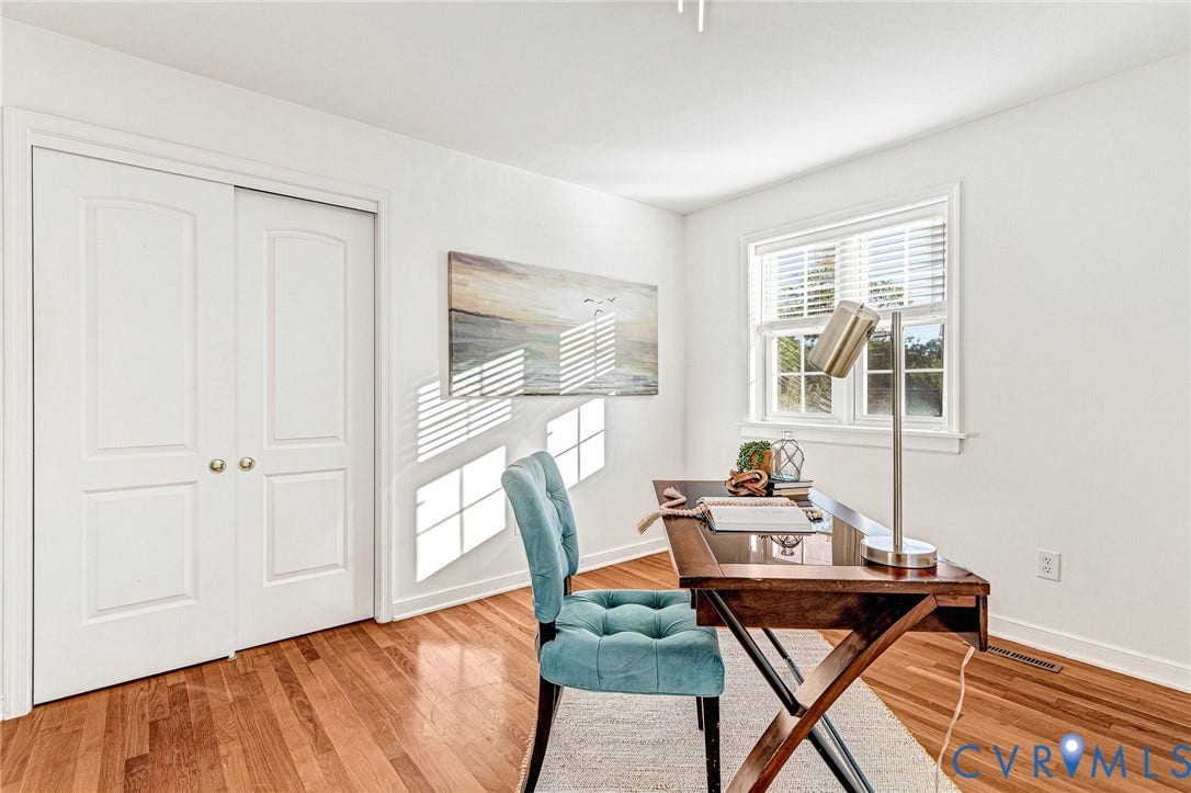4520 Grove Avenue, #U5, Westhampton, Richmond, VA 23221 Hardwood flooring, white painted walls, white trim, window with blinds, and white bi-fold closet doors