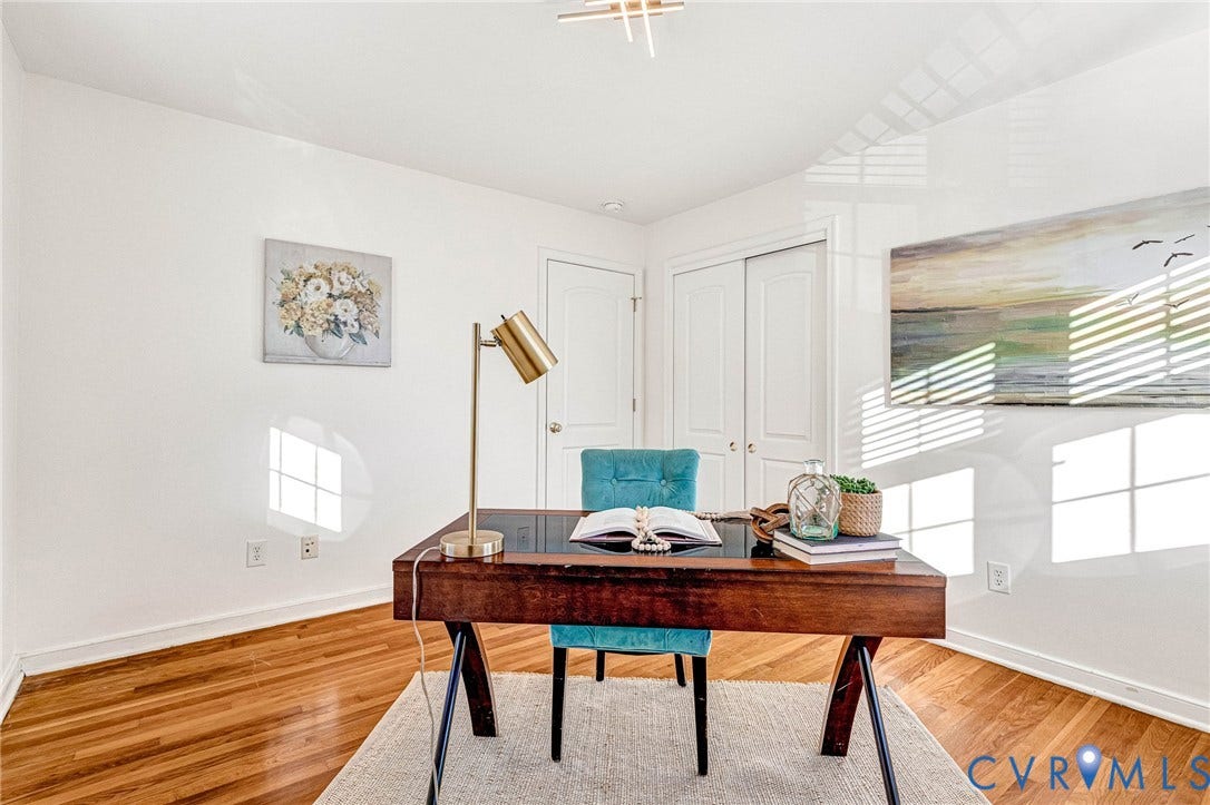 4520 Grove Avenue, #U5, Westhampton, Richmond, VA 23221 Hardwood flooring, crisp white walls, white trim, and a white ceiling