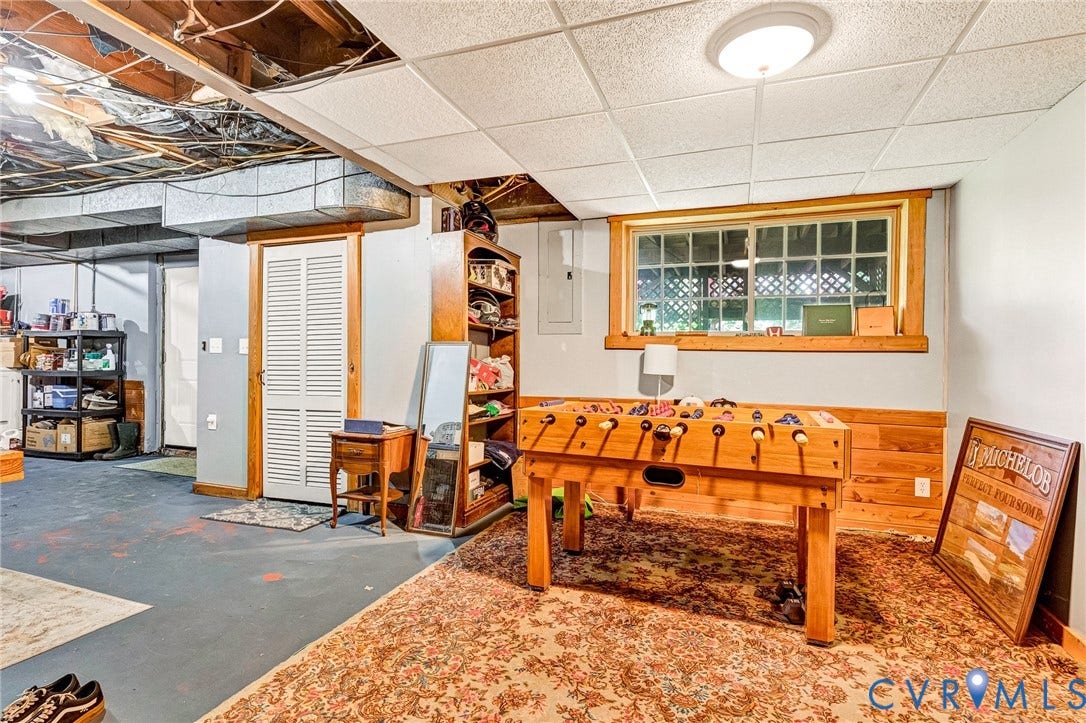 8328 Peaks Road, Hanover, VA 23069 Recessed ceiling with visible ductwork, wood-paneled walls, and a window with wood trim