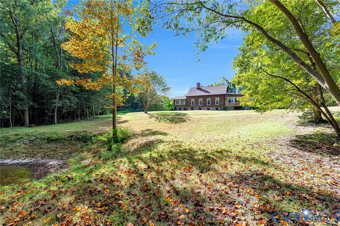 8328 Peaks Road, Hanover, VA 23069 Expansive lawn with mature trees and dense natural landscaping