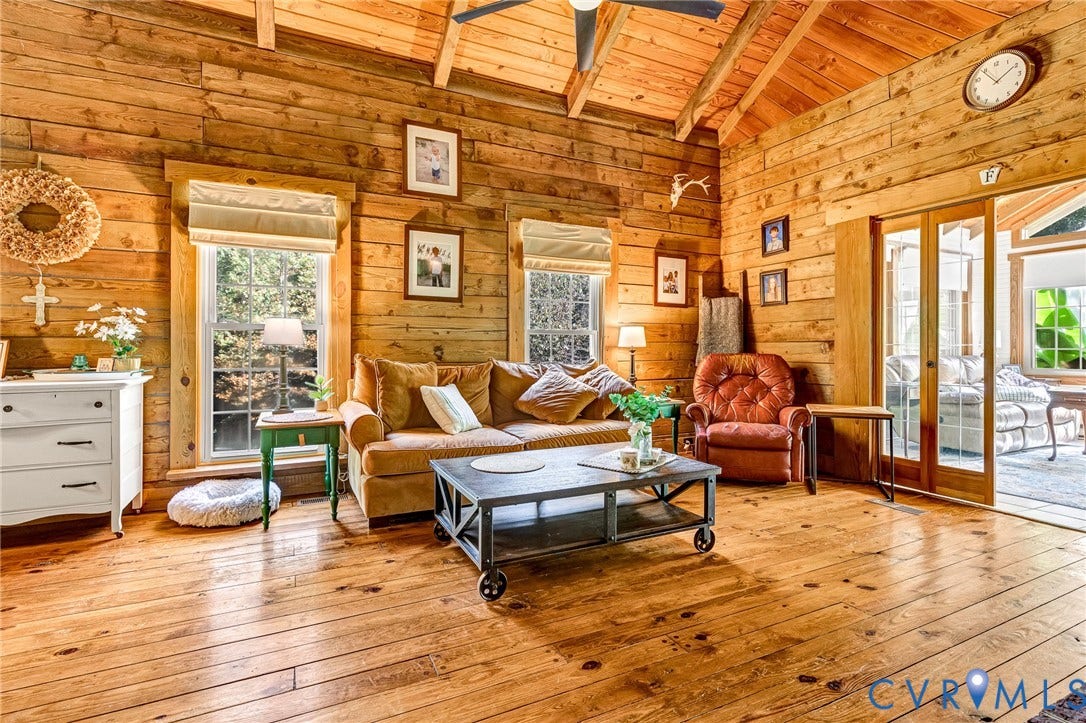 8328 Peaks Road, Hanover, VA 23069 Exposed wood beam construction with vaulted ceilings, natural wood walls, wood-finish flooring, and multiple windows