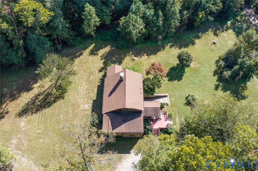 8328 Peaks Road, Hanover, VA 23069 Expansive property featuring a brown shingle roof, mature trees, and a multi-level deck