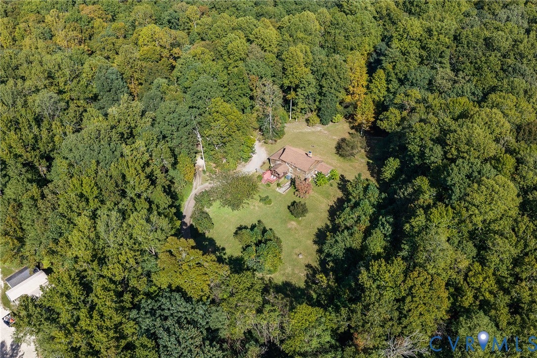 8328 Peaks Road, Hanover, VA 23069 Extensive tree canopy surrounding a residence with a gabled roof and an expansive lawn
