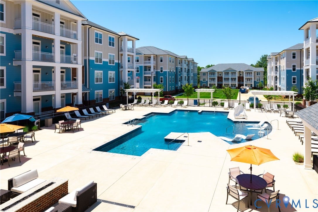 Resort-style pool with integrated lounging areas and surrounding hardscaping